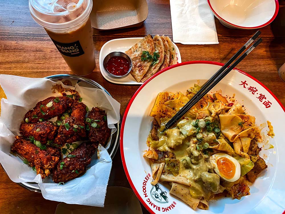Mama Dough signature dishes Biang Biang Noodles, Spicy Cumin Lamb Noodles, Pork and Chive Dumplings, Beef Pancake Roll